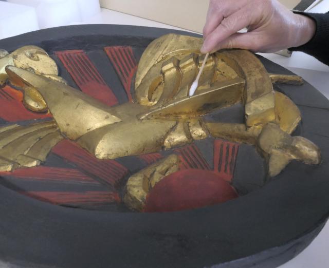 Photo of someone cleaning Gallic Cock by Raymond Duchamp Villon 